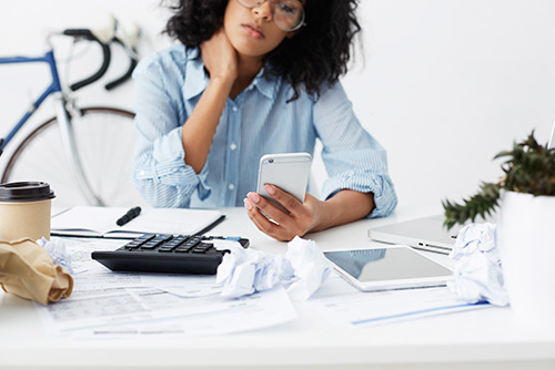 woman with calculator woman with calculator frustrated student loan